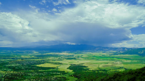 Scenic view of landscape against cloudy sky