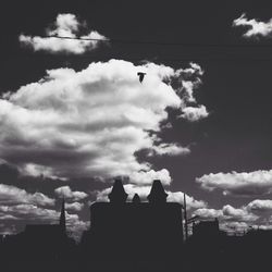 Low angle view of building against cloudy sky