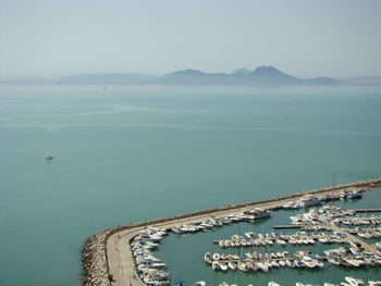 High angle view of sailboats in sea against clear sky