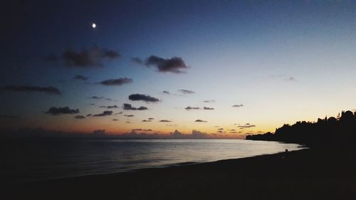 Scenic view of sea against sky at sunset