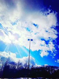 Low angle view of floodlight against sky
