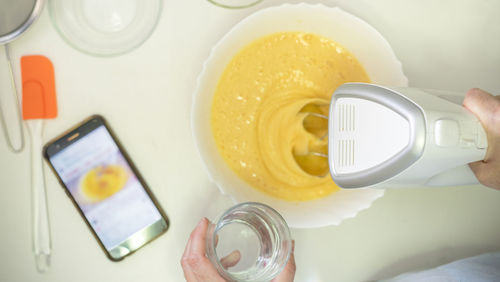 High angle view of person preparing food on table