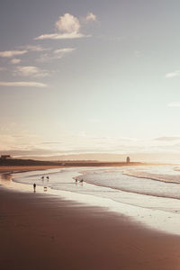 Scenic view of porthcawl beach against sky