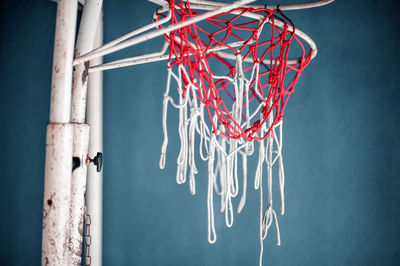 Close-up of basketball hoop against sky