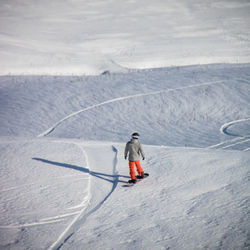 Full length of person skiing on snowcapped mountain