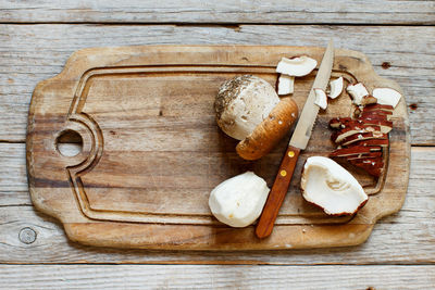 High angle view of bread on cutting board