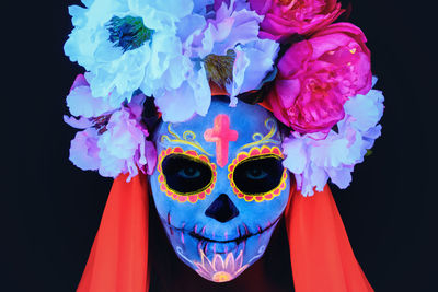 Close-up of mask against black background