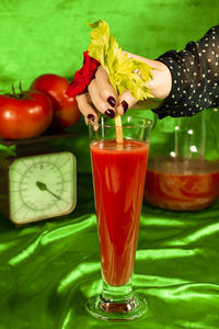 Close-up of cocktail with drink on table