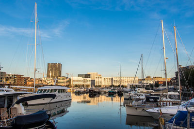 Boats moored at harbor