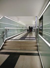 Full length of people walking on railing