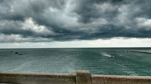 Scenic view of sea against cloudy sky