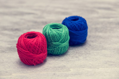 Close-up of colorful wool balls on table