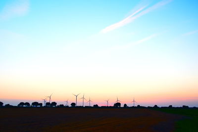 Scenic view of land against sky during sunset