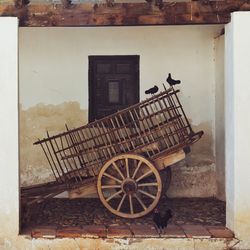 Bicycle parked on wall