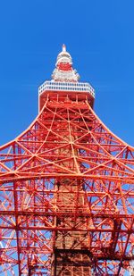 Low angle view of tower against blue sky