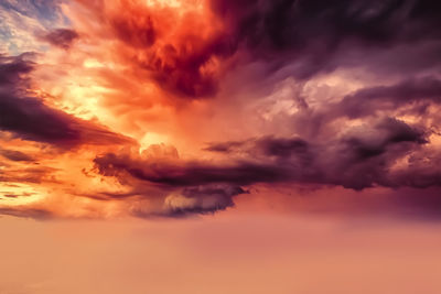 Low angle view of dramatic sky during sunset