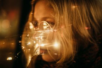 CLOSE-UP PORTRAIT OF WOMAN WITH ILLUMINATED LIGHTS