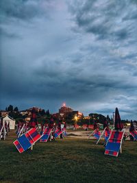 Tent on field against sky at dusk