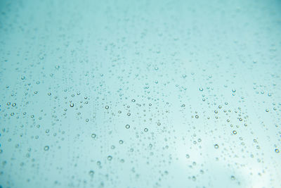 Full frame shot of wet glass window