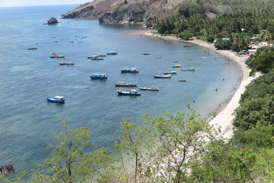 High angle view of sailboats moored on sea