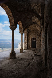 Arches of holy church of agia sophia mystras, scenic view of sea against sky