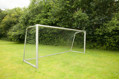 View of soccer field against trees