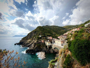 Panoramic view of sea and buildings against sky