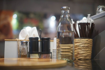 Close-up of wine bottles on table in restaurant