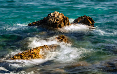 Scenic view of rocks in sea