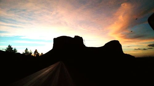 Silhouette of landscape against sunset sky