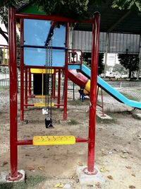 View of playground against trees in park