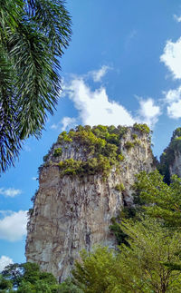 Low angle view of rock formation against sky