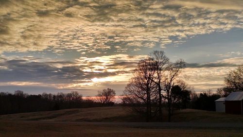 Scenic view of landscape against cloudy sky