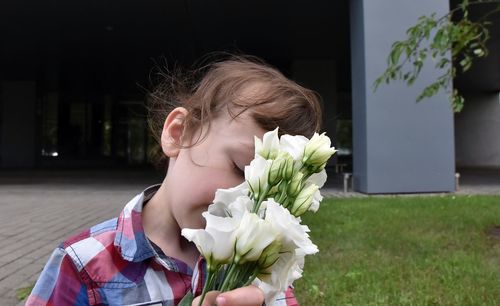 Portrait of girl with pink flower