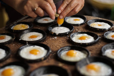 Midsection of man preparing food