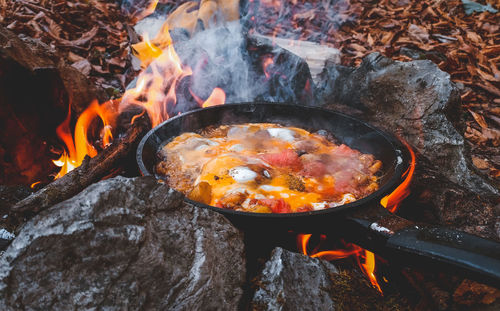 High angle view of bonfire on barbecue grill