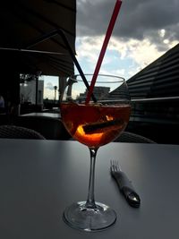 Close-up of red wine against sky