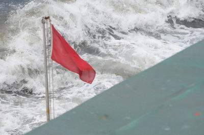 Red flag on snow covered landscape