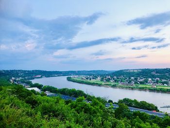 High angle view of river and cityscape against sky