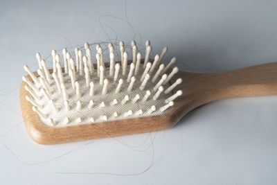 Close-up of hairbrush on white background