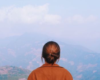 Rear view of woman looking at mountains