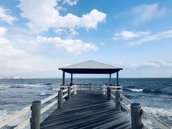 Pier over sea against sky