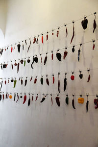 Low angle view of decoration hanging against wall