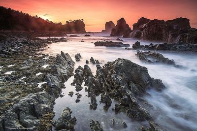 Scenic view of sea at sunset