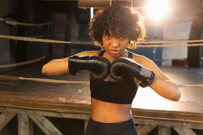 Young woman exercising in gym