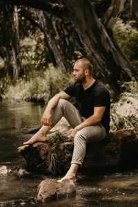 Full length of young man in forest