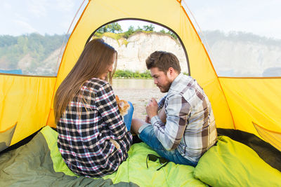 People sitting in tent