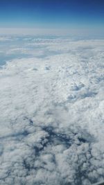 Aerial view of clouds over mountain