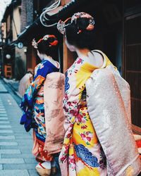 Midsection of woman with umbrella