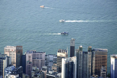 High angle view of hong kong skyline against sea